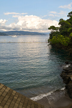 High angle view of the small beach of Niasca in the bay of Paraggi, near Portofino, empty at sunset, Genoa, Liguria, Italy