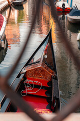 Detail of a venetian gondola as it crosses under a bridge