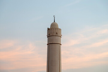 Minaret of the mosque at sunset in Al Ain, UAE