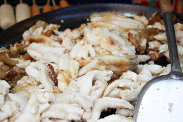 hot fried squid eggs on a pan snack in thailand street market