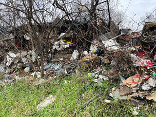 Illegal Landfill in residential area. The problem of environmental pollution in the city center, plastic and other waste. Belgrade, Serbia - 02.10.2024.