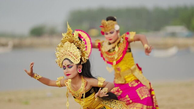 Two young elegant and graceful balinese dancers in Bali, Indonesia, asia