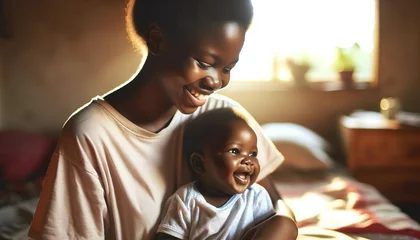 Stoff pro Meter Heringsdorf, Deutschland Happy African mother with her baby indoors at her home in Africa.