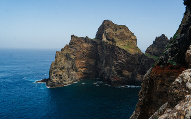 Red rock pillar protruding out of the Atlantic Ocean at the Ponta de São Lourenço (tip of St Lawrence) at the easternmost point of Madeira island (Portugal)