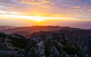 Beautiful sunrise in Madeira highest mountains range. Hiking trial from Pico do Areerio to Pico do...