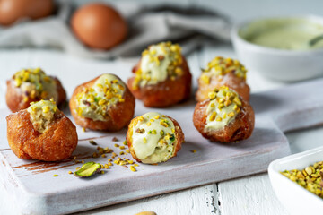 Frittelle di Carnevale with Pistachio Cream and Chopped Nuts