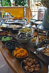 Nuts and fruits prepared for breakfast on the open buffet