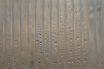 Close up view of the polycarbonate panel with water drops inside it.