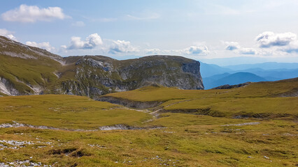 Panoramic view of majestic mount peaks of Hochschwab massif, Styria, Austria. Idyllic hiking trail on high altitude alpine meadow, remote Austrian Alps in summer. Massive rock formation Stangenwand