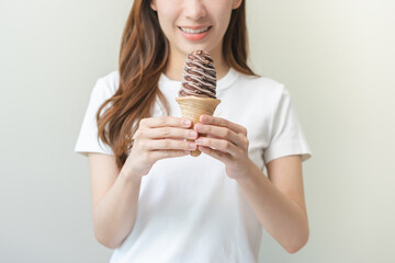 Cheerful enjoy, portrait of happy asian woman have fun with  brunette hair, holding ice cream...