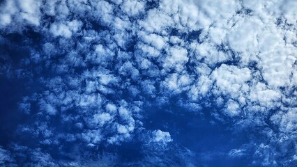 a view of the sky with clouds and a plane