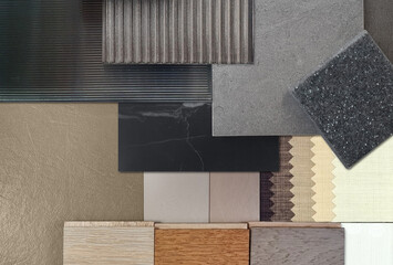 interior material samples for modern loft concept including corrugated glasses, grainy quartz, stone ceramic tiles, black marble, leather laminated, wooden flooring tiles, drapery in close up view.