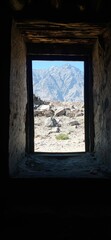 Scenic Mountain Range through Rustic Window of Kharpocho Fort, Skardu, Pakistan