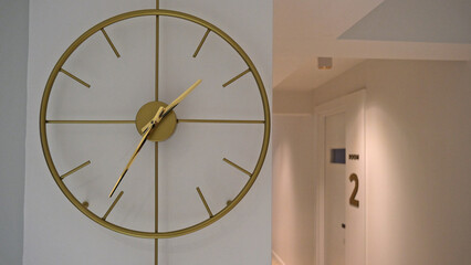 brass color round wall clock