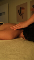 woman getting back massage in white towel