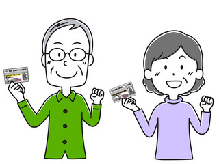 免許を持った高齢男性と高齢女性