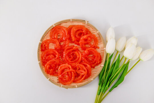 Jalebi or Jilebi Jangri - traditional Indian festival sweet isolated with white background. Popular Indian sweet Jalebi and Fafda served with Sambhara.Also called Jilapi,zulbia,mushabak and zalabia