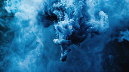 Blue paint drop mixing in water towards to camera. Ink swirling underwater. Cloud of ink isolated on black background. Abstract smoke explosion effect with particles. - obrazy, fototapety, plakaty