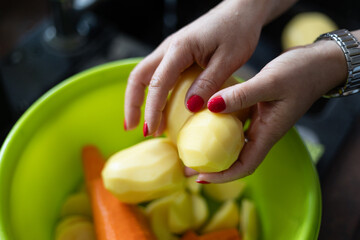 woman female hands holding peeling vegetables with a knife