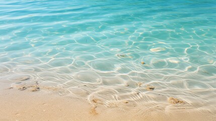 Fototapeta na wymiar Tranquil close up aerial view of gentle ocean waves washing up on a serene sandy beach shoreline