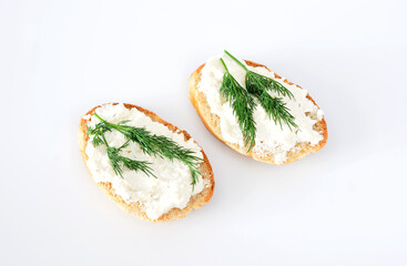 slices of bread with cottage cheese and dill on white background top view 