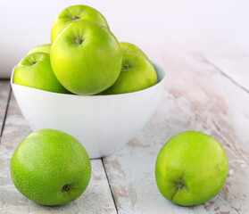organic granny smith apples on wooden table