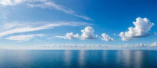 Wide view shows quiet sea under big sky at nightfall. Soft waves move on ocean top, showing off dim...