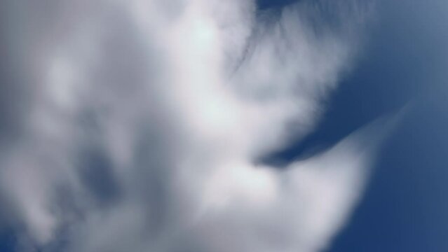 White clouds appearing and flowing from the air in the blue sky. Cloudscape, Japan
