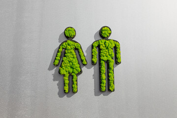 woman and man symbols made of grass 