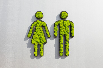 man and woman symbols from grass