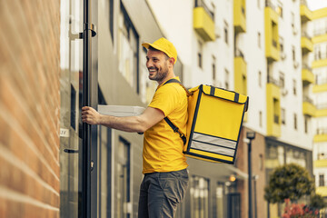 Pizza delivery man holding delivery box with pizza