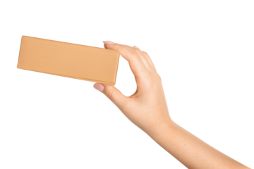 A woman's hand holds a cardboard box on an empty background.