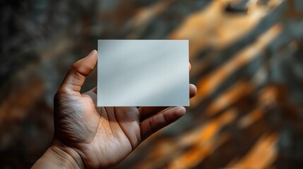 Mockup concept of hand and blank business card without logo and text