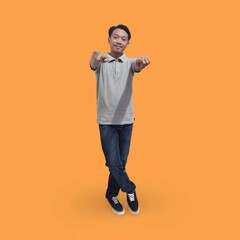 Fototapeta na wymiar Full length image of cheerful man in his 30s wearing t-shirt and jeans showing finger while posing and smiling isolated on orange background