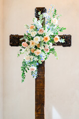 floral arrangement on cross