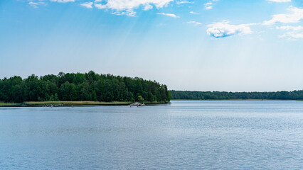 A fast river under a blue sky.