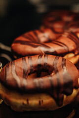 Close up chocolate sweet freshly baked donuts with topping