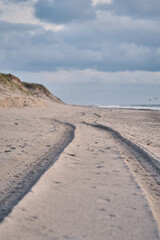 Tire Tracks on beach in denmark. High quality photo - 744686084