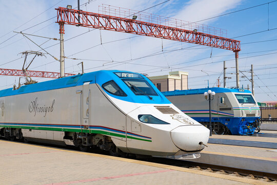 KAGAN, UZBEKISTAN - SEPTEMBER 14, 2022: The locomotive of the Talgo 250 "Afrosiyob" high-speed train at the platform of Bukhara-1 station on a sunny day