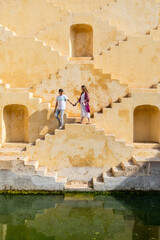 Couple at ancient stepwell in Jaipur