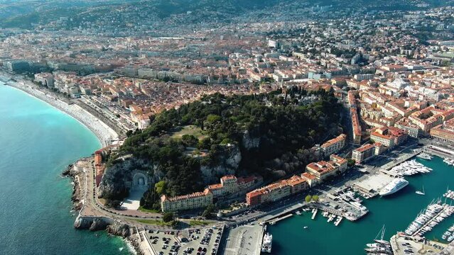 Panoramic aerial view of Nice, France. Beautiful hill ft. scenery landscape of harbor, port in Cote d'Azur. Luxury leading resort city of French riviera seen from above with Mediterranean Sea in 4K