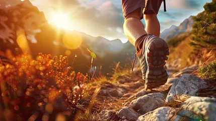 Fotobehang Trekking. Men's legs with sports shoes and a backpack run along a mountain path. Travel and camping adventure lifestyle with outdoor activity  © Ilmi