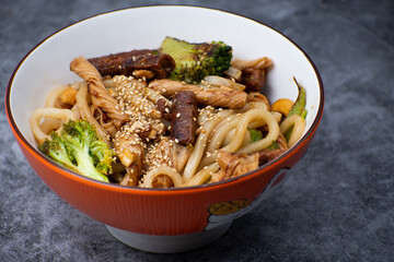 Vegan udon and seitan, yuba and broccoli bowl