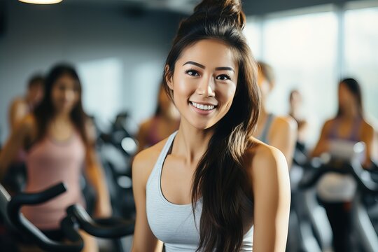 Wide shot a asian woman riding a spin bike at the gym Generative AI