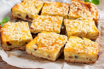 Rustic grated cottage cheese cake with milk on a table