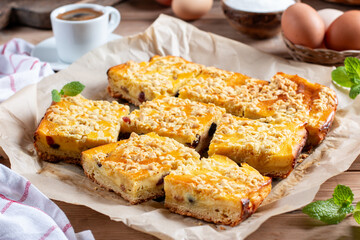 Rustic grated cottage cheese cake with milk on a table