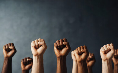 Fists raised upward as a sign of struggle for unity among all people