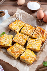 Slice of fresh homemade cottage cheese cake on table. Flat lay.