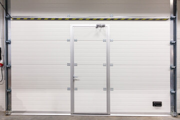 Industrial Garage Gate With White Roller Shutter Door and Integrated Pedestrian Access