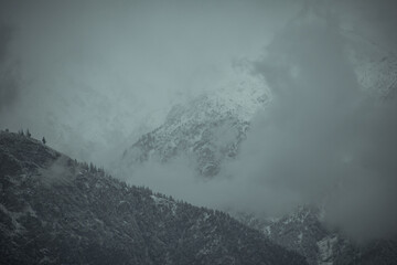View of foggy snow-covered mountains.